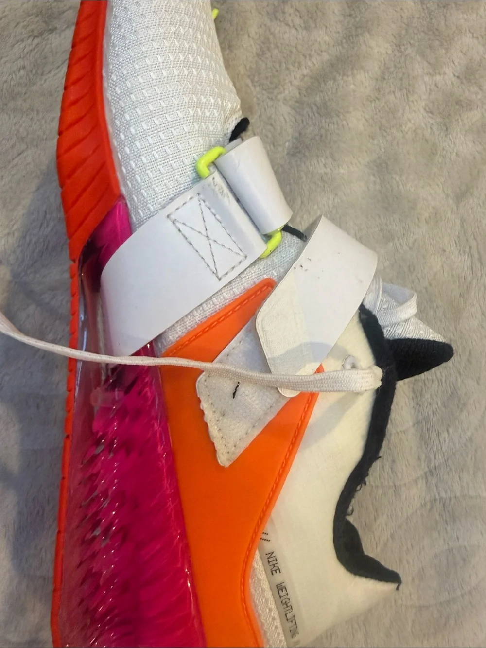 Nike White Athletic Shoes with Black Swoosh and Red Sole